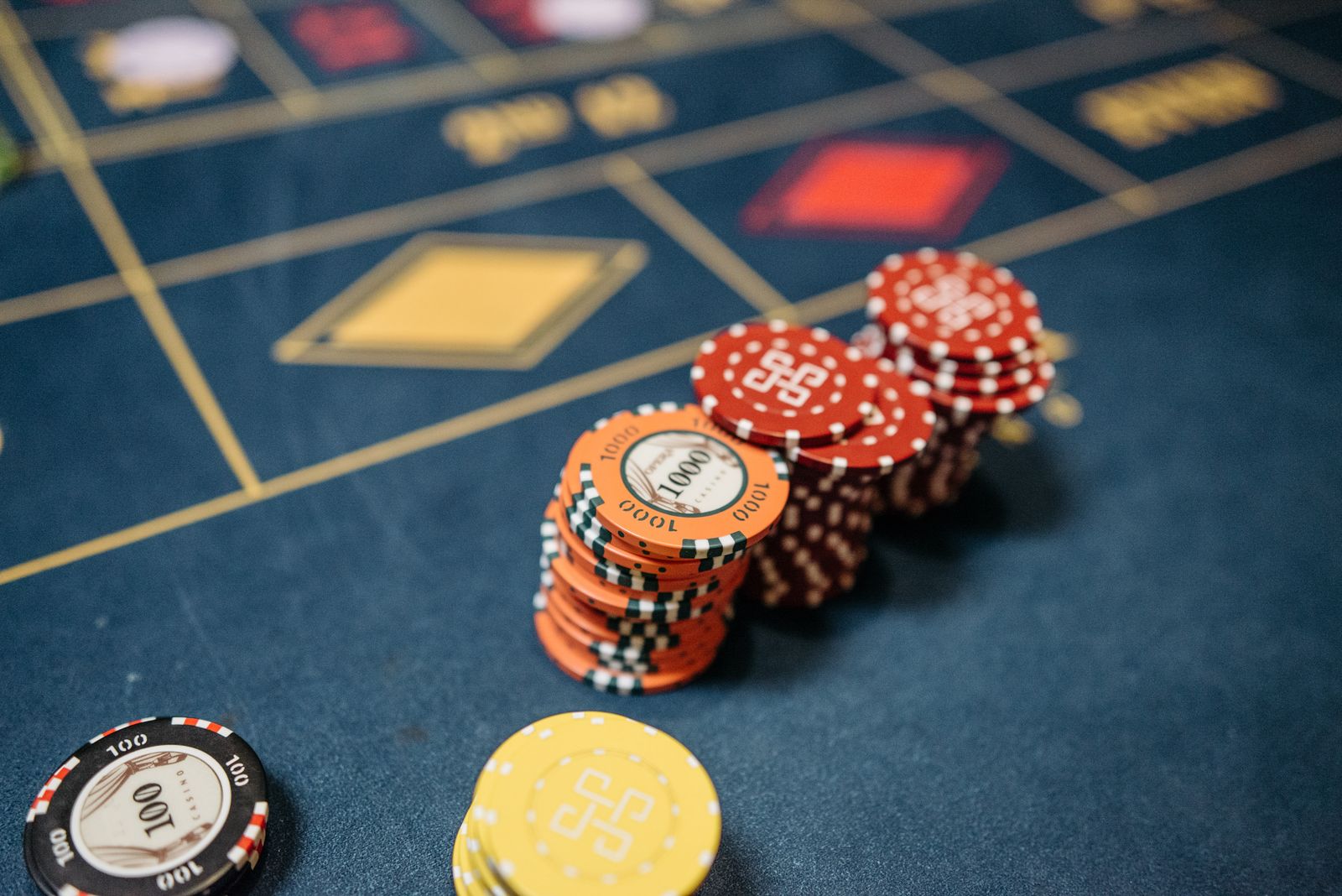 Casino chips and roulette table used as illustrative stock imagery